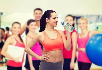 Image showing sporty woman with water bottle