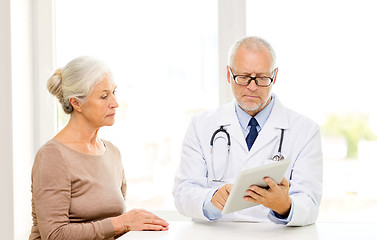 Image showing senior woman and doctor with tablet pc