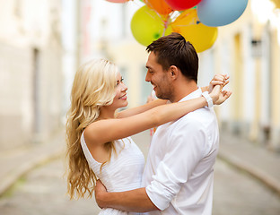 Image showing couple with colorful balloons