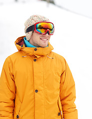 Image showing happy young man in ski goggles outdoors