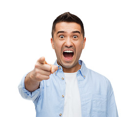 Image showing scared man shouting and pointing finger on you