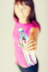 Image showing sporty woman with bottle of water