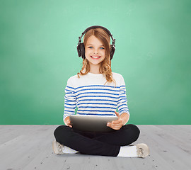 Image showing happy school girl with headphones and tablet pc