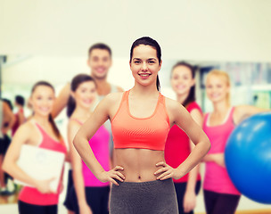 Image showing smiling teenage girl in sportswear