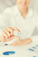 Image showing man hands with gambling dices signing contract