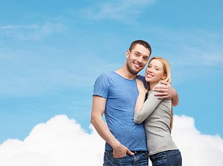 Image showing smiling couple hugging