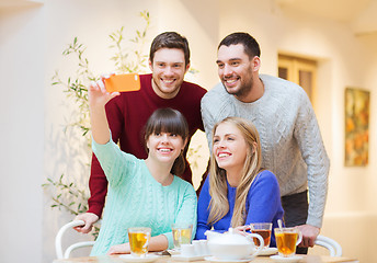 Image showing group of friends taking selfie with smartphone