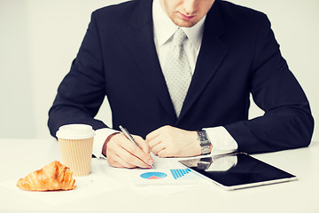 Image showing man with tablet pc and cup of coffee