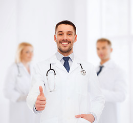 Image showing smiling doctor with stethoscope showing thumbs up