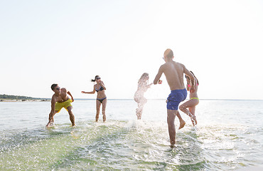 Image showing happy friends having fun on summer beach