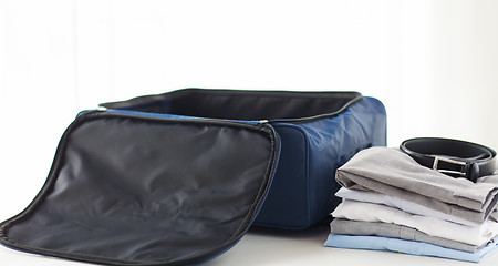 Image showing close up of business travel bag and clothes