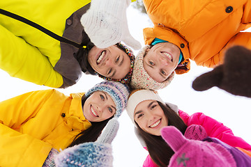 Image showing happy friends in winter clothes outdoors