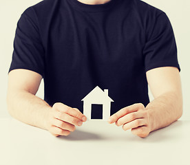 Image showing man hands holding paper house