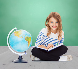 Image showing girl with globe and book