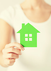 Image showing woman hands holding green house