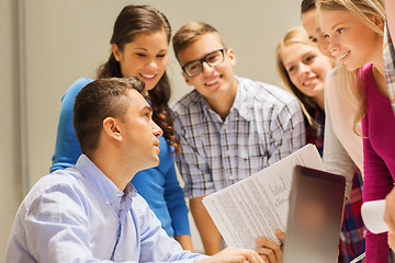 Image showing group of students and teacher with laptop