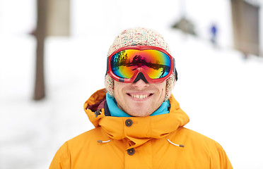 Image showing happy young man in ski goggles outdoors