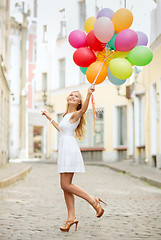 Image showing woman with colorful balloons