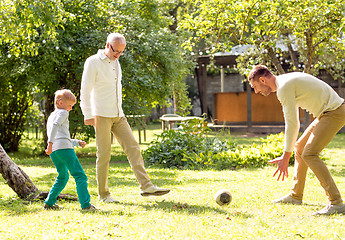 Image showing happy family playing football outdoors