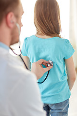 Image showing close up of girl and doctor on medical exam