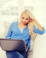 Image showing woman with laptop computer at home