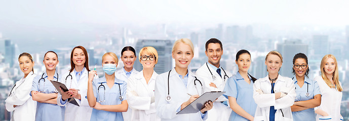 Image showing smiling female doctors and nurses with stethoscope