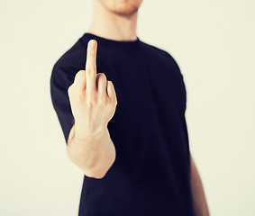 Image showing man showing middle finger