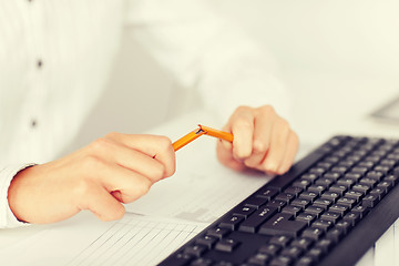 Image showing woman breaking pencil