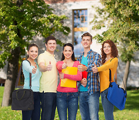 Image showing group of smiling teenagers showing thumbs up