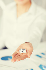 Image showing man hands with gambling dices signing contract