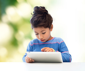 Image showing little girl with tablet pc over green background