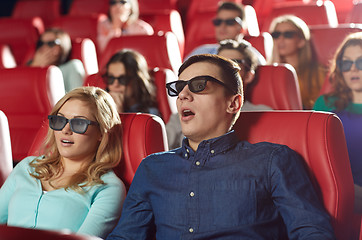 Image showing friends watching horror movie in 3d theater