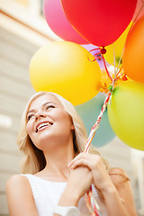 Image showing woman with colorful balloons