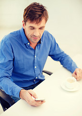 Image showing buisnessman with smartphone and cup of coffee
