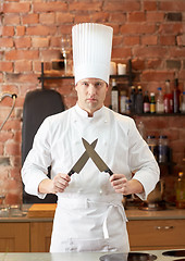 Image showing happy male chef cook in kitchen with knife