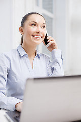 Image showing smiling businesswoman with laptop