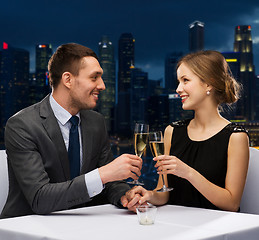 Image showing couple with glasses of champagne at restaurant