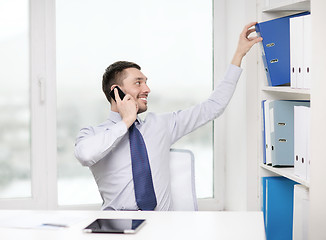 Image showing businessman with smartphone and tablet pc