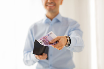 Image showing close up of businessman hands holding money