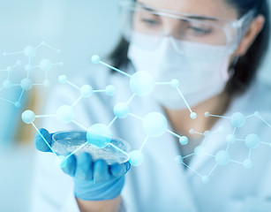 Image showing close up of scientist holding petri dish in lab