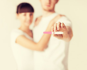 Image showing woman and man hands with pregnancy test