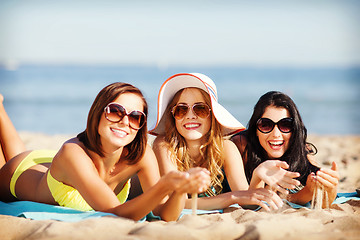 Image showing girls sunbathing on the beach