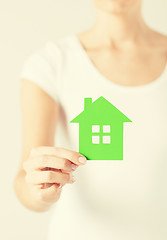 Image showing woman hands holding green house