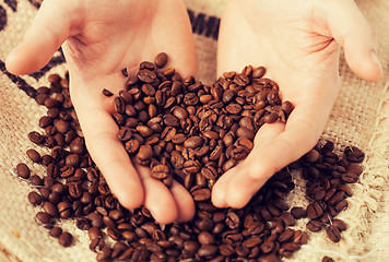 Image showing man holding coffee beans