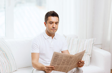 Image showing man reading newspaper at home