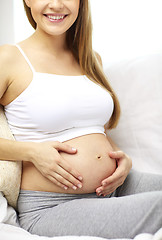 Image showing close up of happy pregnant woman at home