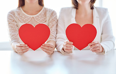 Image showing close up of happy lesbian couple with red hearts