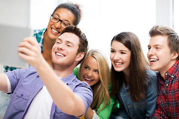 Image showing students taking selfie with tablet pc at school