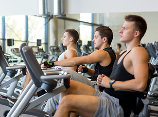 Image showing men working out on exercise bike in gym