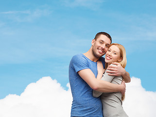 Image showing smiling couple hugging